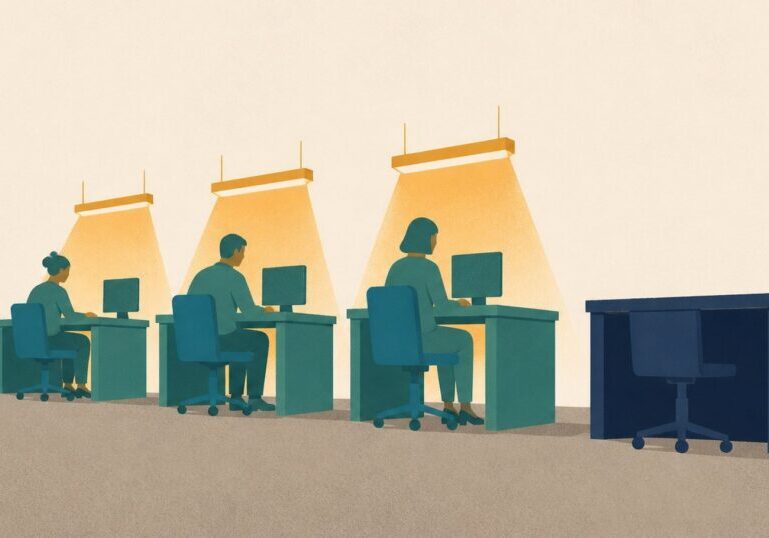 A row of warmly lit office workstations with one dark, empty desk on the right, illustrating what happens to an account when no legacy contact has been named.
